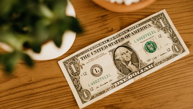 A U.S. dollar bill symbolizing the One Big Beautiful Bill—a proposed unified tax reform plan aiming to simplify and consolidate the federal tax code.
